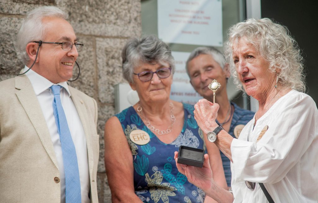 Chair of the Edward Hain Trustees holds the original key to the hospital