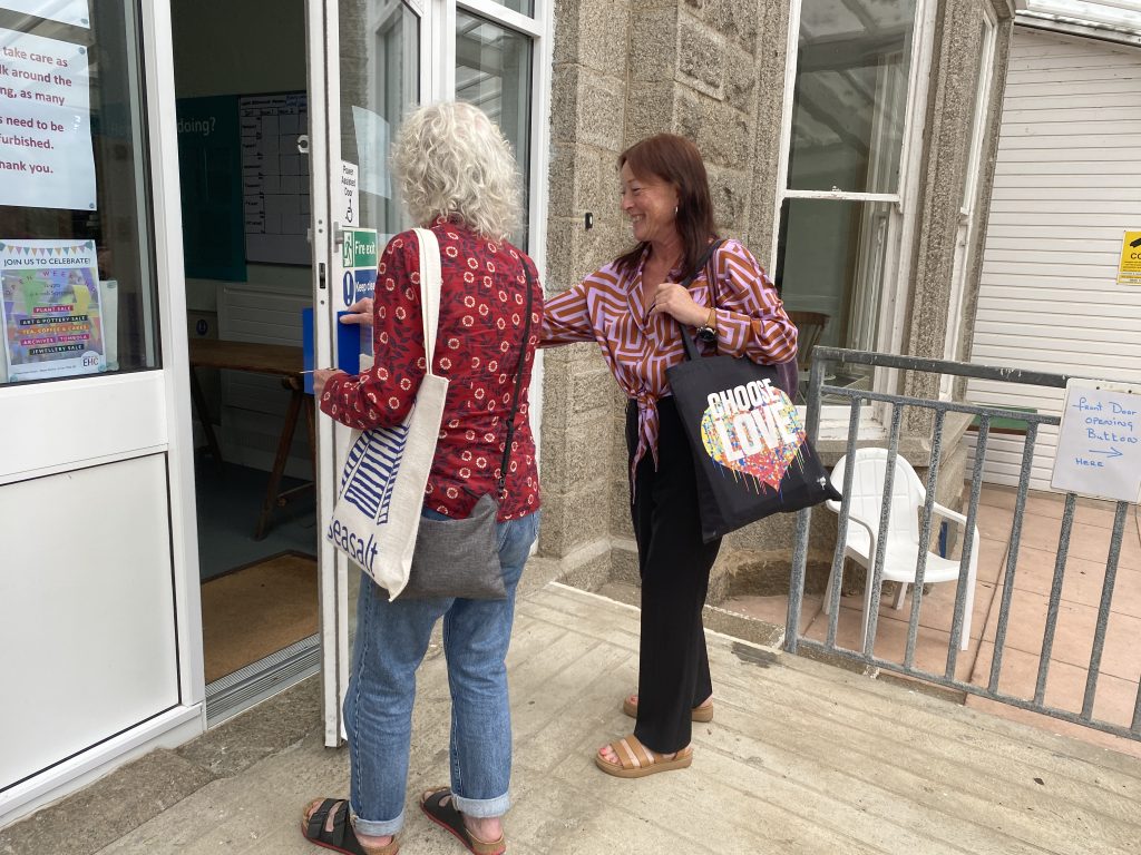 2 women at the front door of the Edward Hain Centre