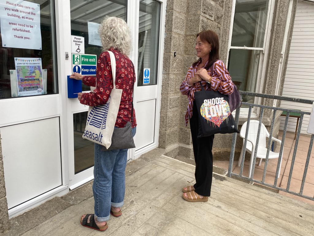 2 women at the front door of the Edward Hain Centre