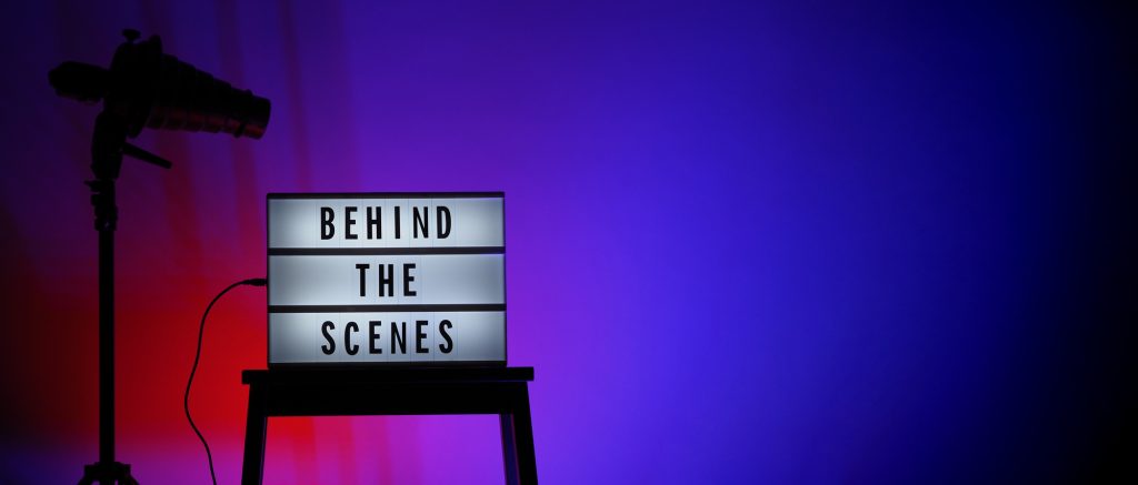 Picture of writing, 'Behind the Scenes'