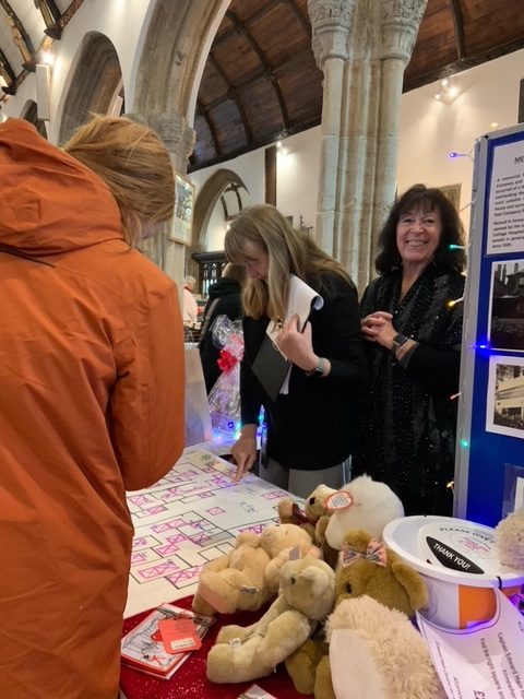 Friends helping at the stall