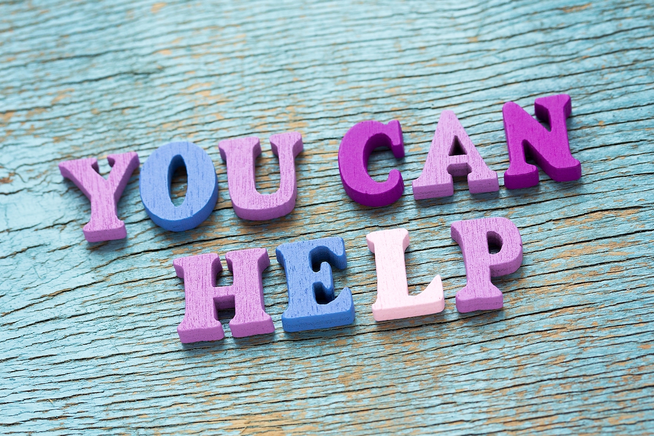 Letters on wood saying 'You can help'