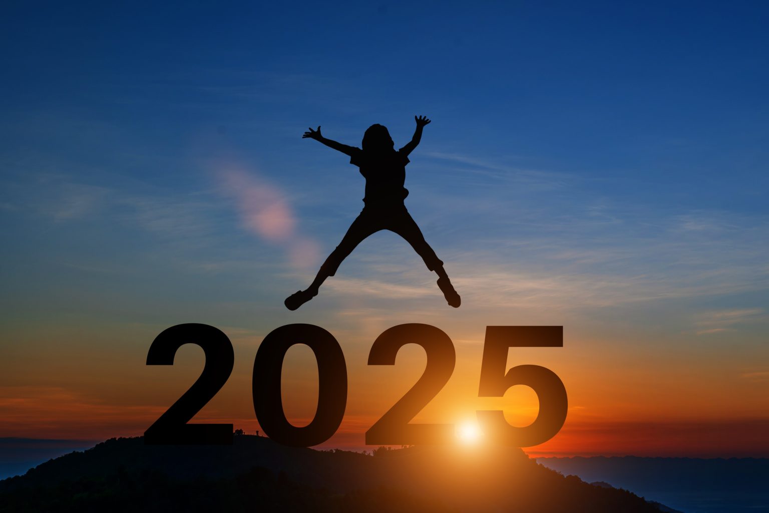 Image of someone jumping for joy over the numbers '2025'