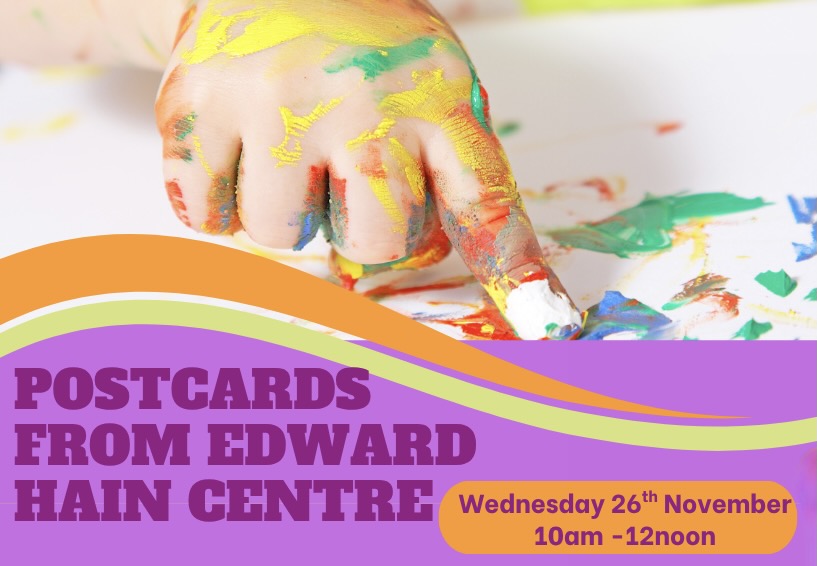 Photo of a child's paint-covered hand pointing at an image