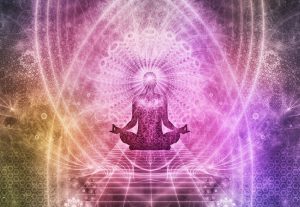 Image of meditating person and energy fields