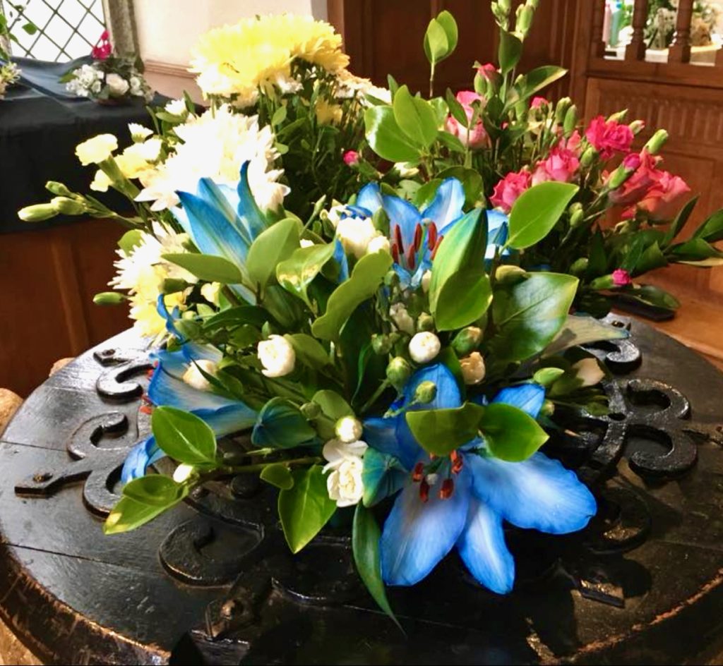 Photo of flower display at St Ia's church, blue flowers