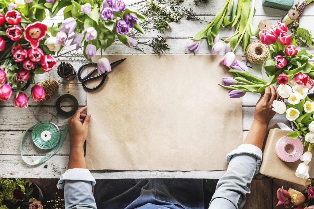 Photo of woman's hands about to make a flower display