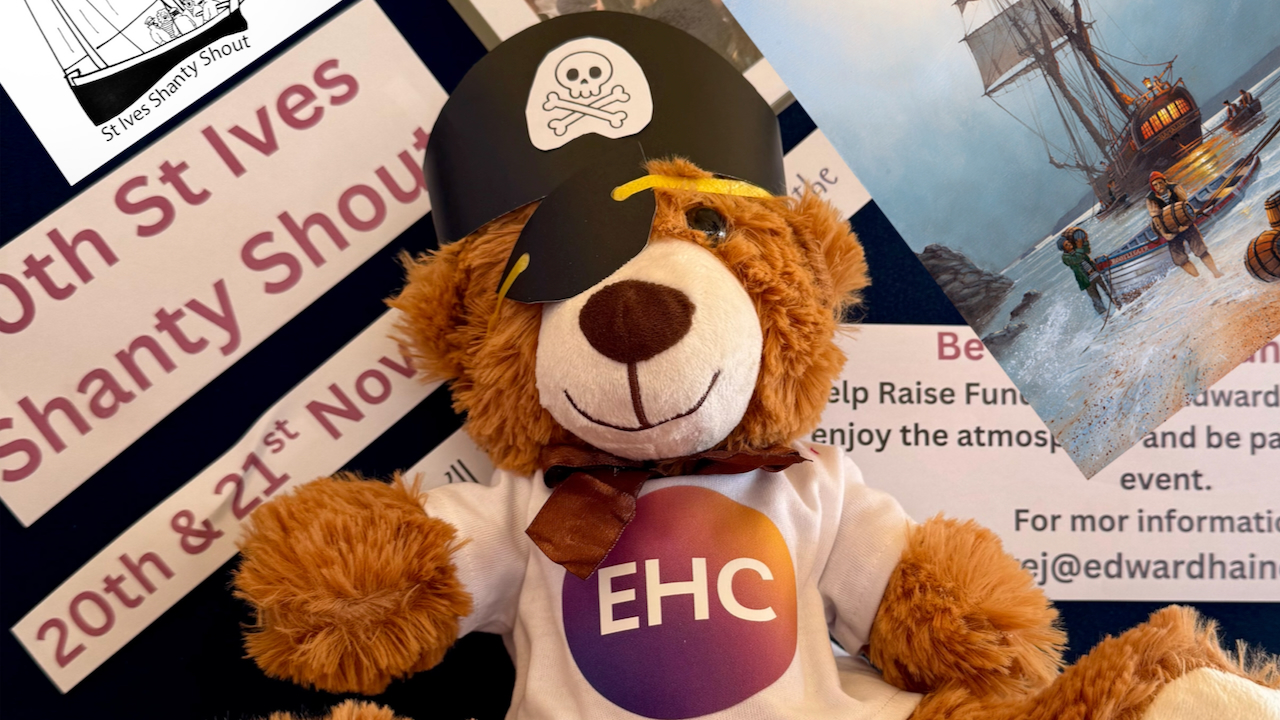 Shanty Teddy with pirate hat and Shanty Shout publicity behind him